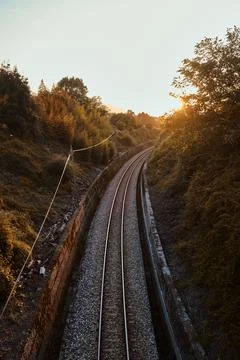 Railway of an old train in a sunset Stock Photos