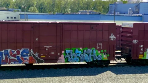 Railway Or Train Yard with Cargo Train Cars Covered with Graffiti Drawing. Stock Footage 153433755