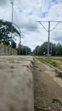 Railway Platform Edge Under Cloudy Sky Stock Photos