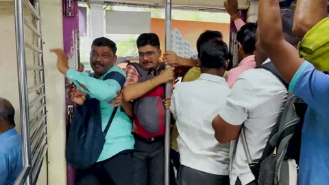 Railway platform packed with people. 4K (Busy train station) Stock Footage 255003448
