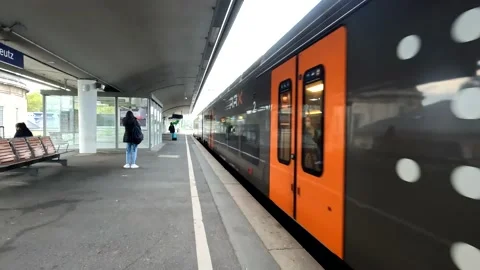 Railway platform with train passing by Stock Footage 202637966