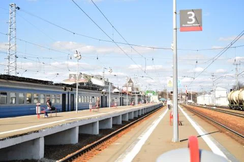 Railway platform with a train. Stock Photos