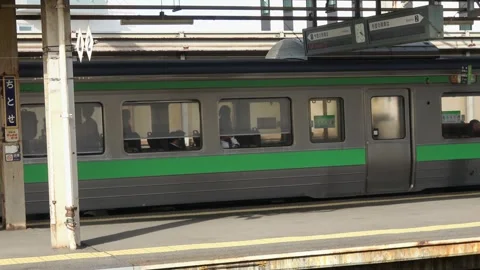A railway platform at twilight, Chitose Station, Hokkaido, Japan, May 24, 2025. Stock Footage 335735939