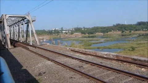 Railway river bridge crossing View from fast moving train window, Gujarat India Stock Footage 98917361