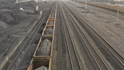 Railway station for loading coal. Wagons of freight train aerial view. Cargo Stock Footage 283913065
