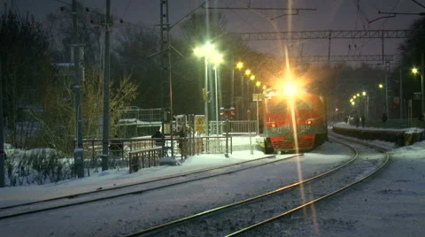 Railway Station. Night Time. First Time Snowing Quietly. Electric Train Going Stock Footage 68614446