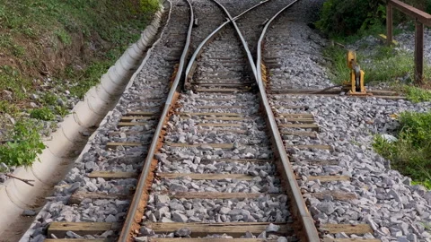 Railway switch revealing Y track junction with forward move 4k60 Stock Footage 332773186