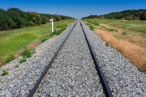 Railway through the forest Stock Photos