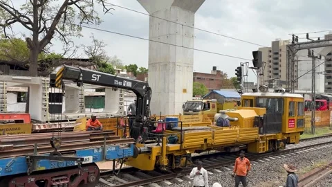 Railway track construction workers with maintenance machine urban Stock Footage 333627428