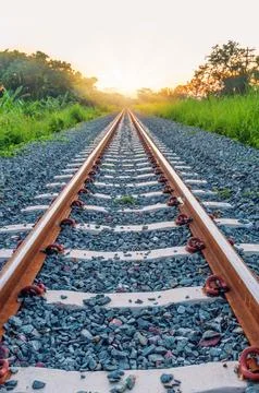 Railway track with sun light at front Stock Photos