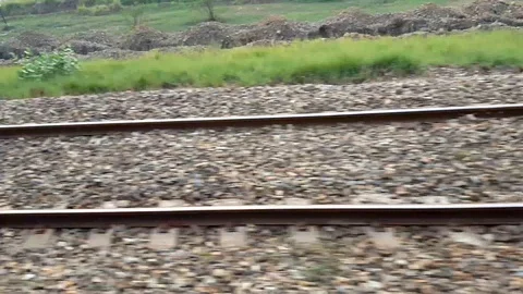Railway Track From A Window Of Fast Running Train In Day Light Stock Footage 97346055