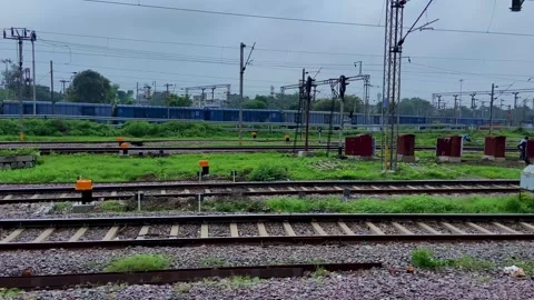 Railway Tracks and Blue Freight Train in Railway Yard Vídeos de archivo 341723708