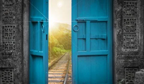 Railway tracks behind open door Stock Photos