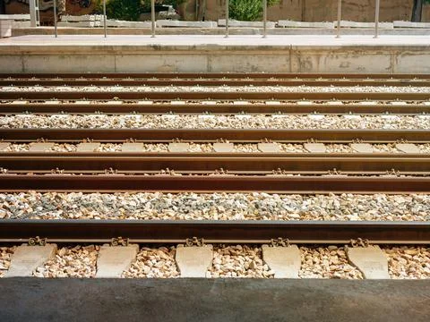 Railway tracks between the two platforms of the railway station Stock Photos
