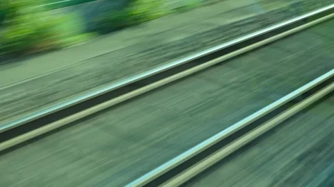 Railway tracks blurs passing by from fast moving train window. Stock Footage 341266476
