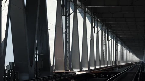 Railway tracks running through large steel bridge structure in Assam Stock Footage 330706243