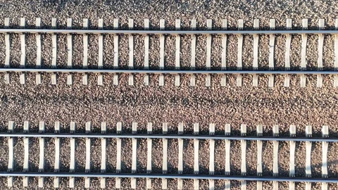Railway tracks showing continuous alignment of metal rails and gravel bed Видео 333076974