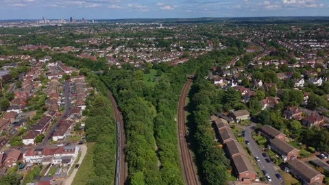 Railway tracks in Y shape with trains in Sutton Greater London aerial view Stock Footage 337120236