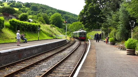 Railway train approaching a station Stock Footage 82490408