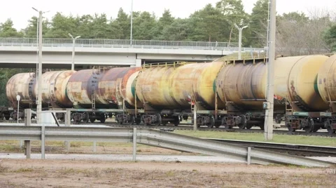 Railway train going under the bridge on forest background Video stock 45038837