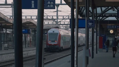Railway train leaving the station. The train leaves the station. Stock Footage 107659374