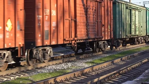 A railway train of shipping containers, slow motion video Stock Footage 99869752