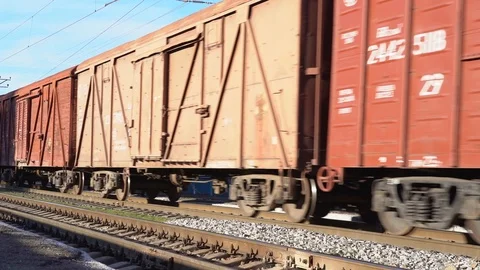 A railway train of shipping containers, slow motion video Video stock 99870178
