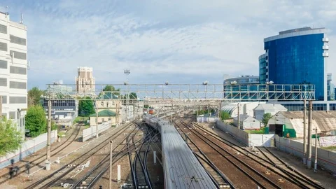 Railway with trains, blue sky with clouds on background 4k, 3840, 2160p Stock Footage 79920244