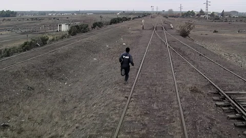 Railway Worker Running Toward Track Switch Seen From Locomotive - 4K Stock Footage 319834151