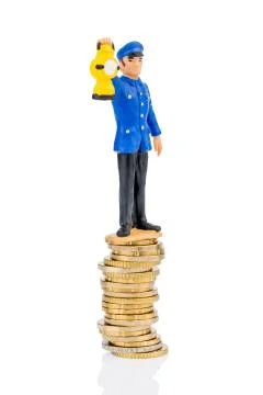 Railway worker stands on money stack Stock Photos