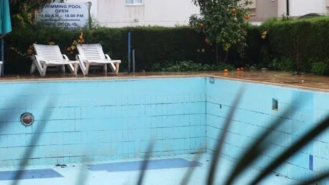 Rain on the abandoned pool Stock Footage 225890142