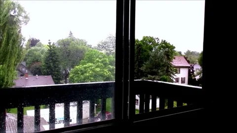 Rain and bird sounds, window, balcony, homes, trees Stock Footage