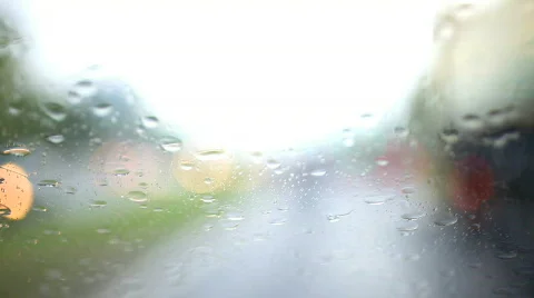 Rain and Car driving by day Stock Footage