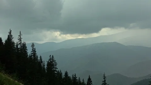 Rain and clouds over mountain valley Stock Footage 95078441