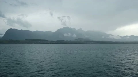 Rain and dark hours of Thun Lake Stock Footage 198511372