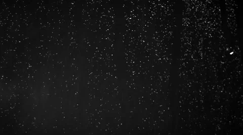 Rain and drops on window in stormy  weather against black background, close up Stock Footage