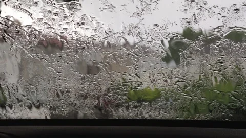 Rain and Hail Falling on Car Windshield Close Up Vidéo 336500133
