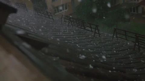 Rain and hail flows down on a roof Видео 161778673