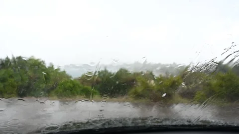 Rain and hail on the windshield of the car. Thunderstorm in summer. Stock Footage 248422063