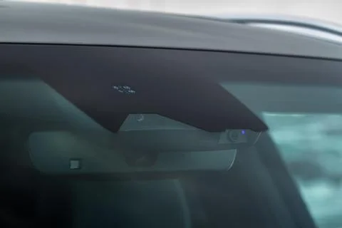 Rain and light sensor on the windshield of the car Stock Photos