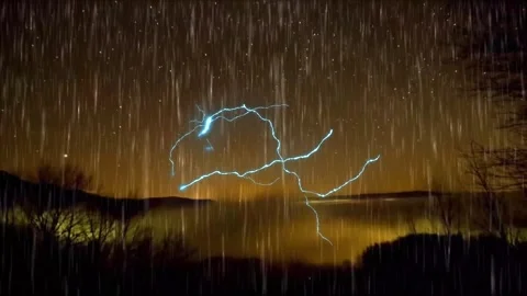 Rain and Lightning Under a Starry Night Sky Video stock 325329002