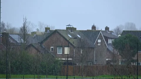 Rain and sleet weather in small city in Europe Stock Footage 235235322