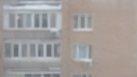 Rain and snow are falling outside the window Stock-Footage 169885357