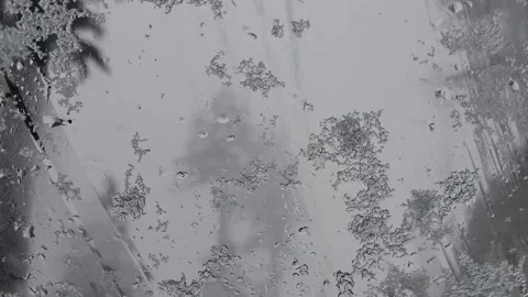 Rain and snow drops on the car windscreen Stock Footage 280637468