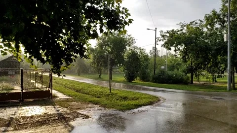 Rain and sunshine in a small village Video Stock Footage 252532853