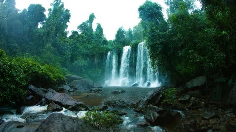 Rain and a tropical waterfall in Phnom Kulen National Park 스톡 동영상 73011104