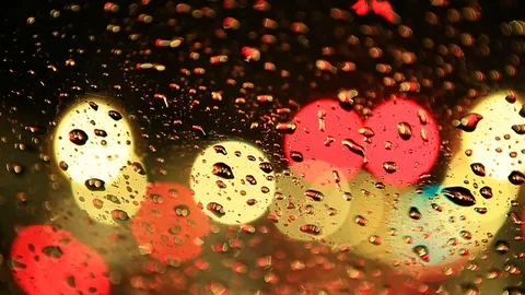 Rain and Water on Windshield with Blurred Traffic - Shallow Depth of Field Stock Footage 100612934