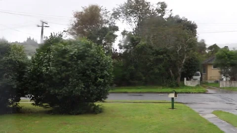 Rain And Wind Build, Droplets On Window In New Zealand Neighborhood Vídeo Stock 89121036