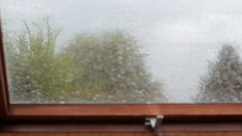 Rain on attic window Stock Footage 268841607