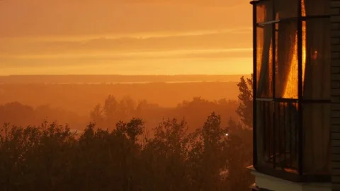 Rain on the background of Beautiful Sunset. The Balcony Of A Multistory Building Stock Footage 78978910